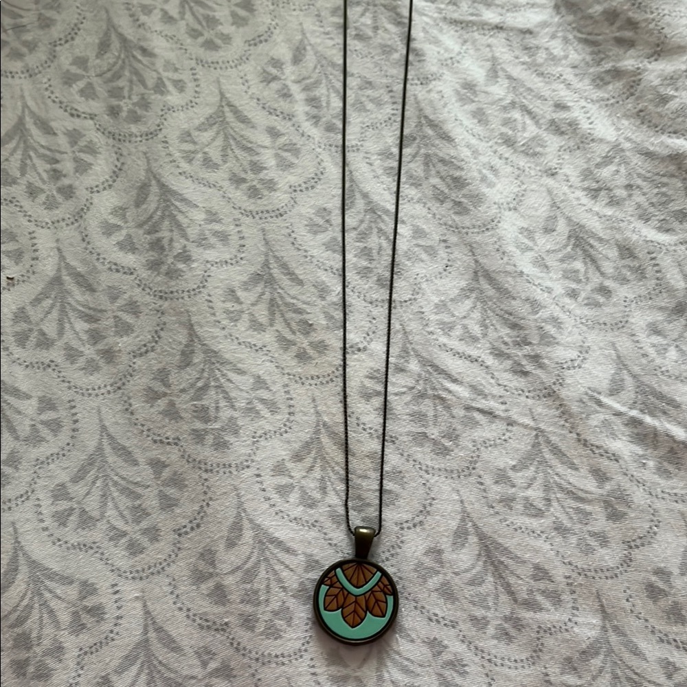 Elegant Pendant Necklace with Turquoise and Brown Accents